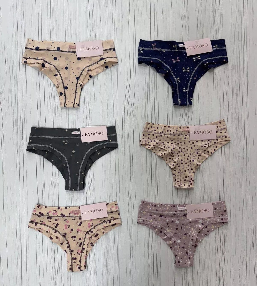 Set of six pairs of patterned underwear on a wooden surface with 'Famoso' labels.