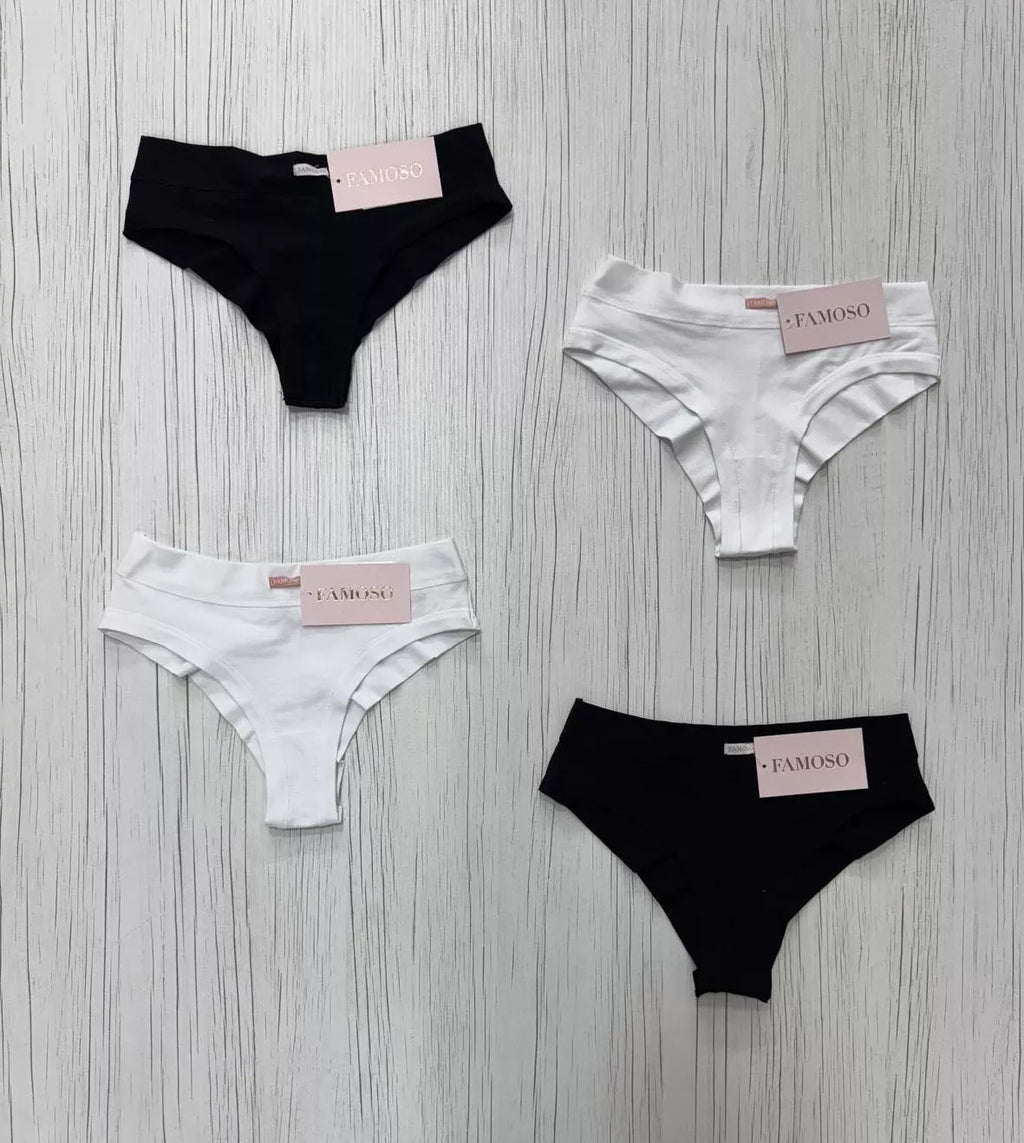 Four pairs of underwear, two black and two white, on a gray wooden surface with 'FABIOSO' branding.